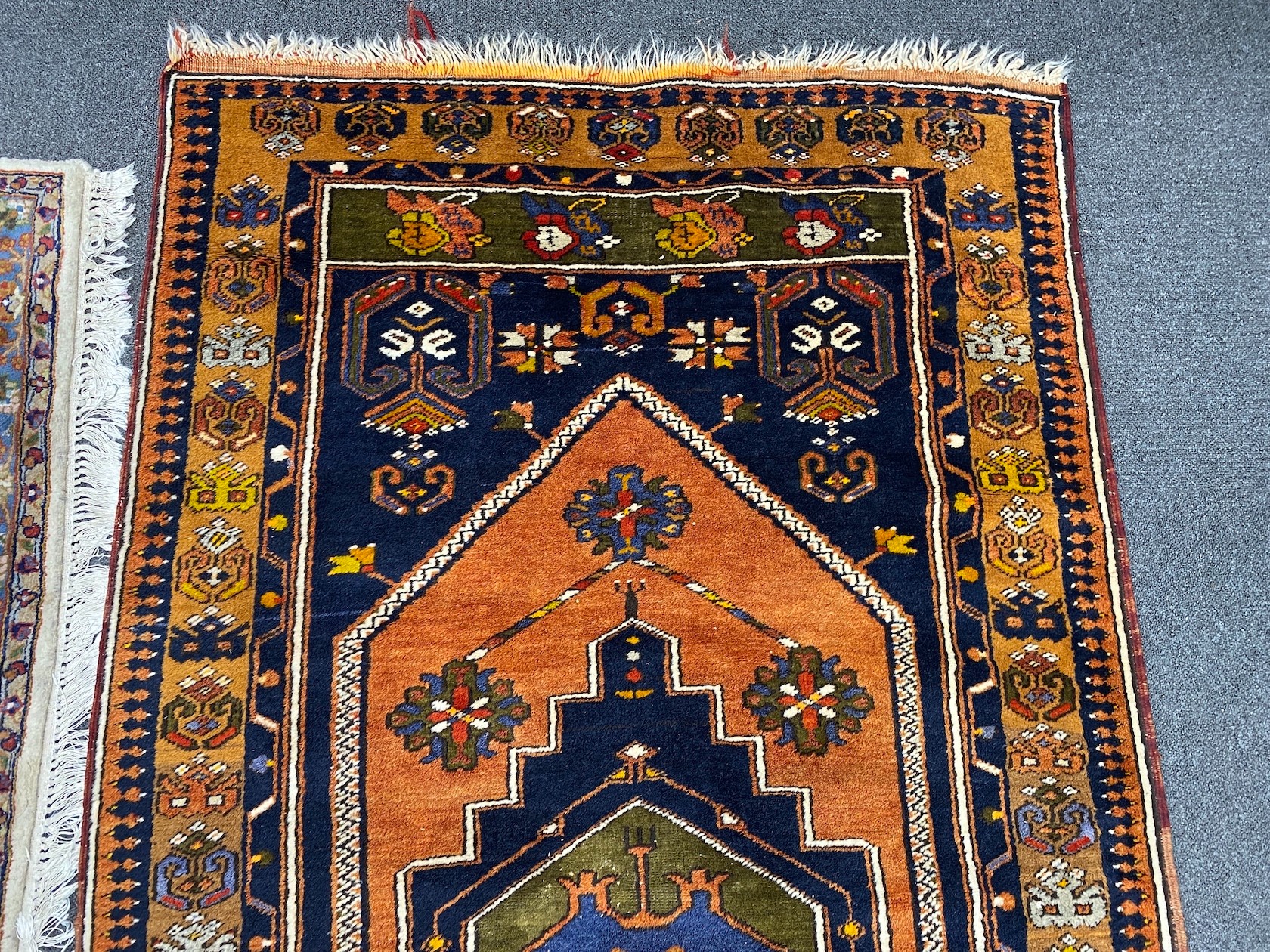 A Caucasian design blue ground rug, 204 x 104cm